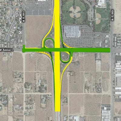 A map showing the proposed redevelopment of an intersection with changes highlighted: existing roads in green, proposed additions in yellow, and areas to be removed in red.