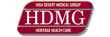 The image shows the logo of High Desert Medical Group with the acronym HDMG and the tagline "Heritage Health Care" on a dark red background.