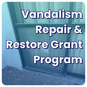 Text on image: Vandalism Repair & Restore Grant Program. Background shows a broken window.