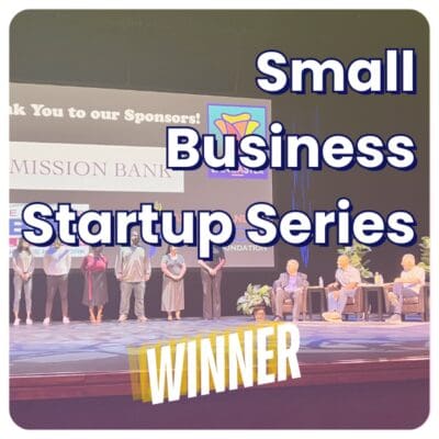 People standing on a stage for the Small Business Startup Series, celebrated as the Winner with a banner at the bottom, proudly alongside Lucky Luke, January 2025s business of the month.