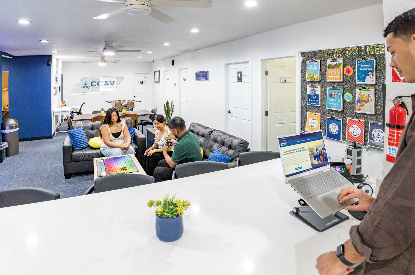Children's Center reception area with staff and visitors in Lancaster, CA.